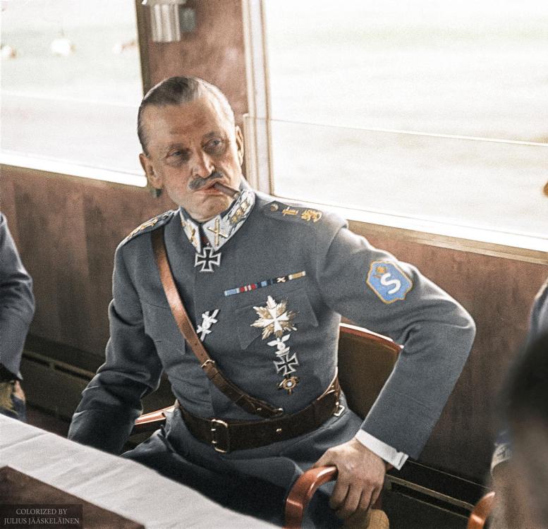 Marshal_of_Finland_Carl_Gustaf_Emil_Mannerheim_having_a_cigar_in_a_train_during_his_visit_in_Germany,_1942._(49960472022).jpg